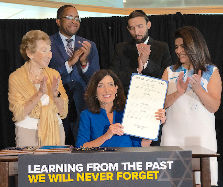 New York governor signs legislation to aid Holocaust survivors, support education