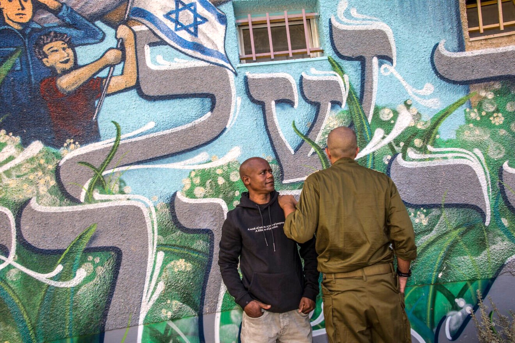 Eritrean migrant Mulugeta Tsegay and the Israeli officer he saved during the Hamas-led terrorist attacks in southern Israel on Oct. 7, 2023, Nov. 13, 2025. Photo courtesy of Rina Castelnuovo.